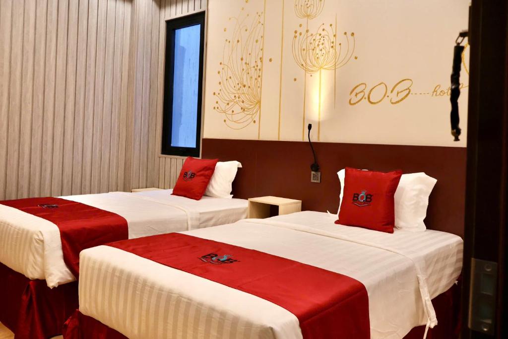Ένα ή περισσότερα κρεβάτια σε δωμάτιο στο BOB Hotel Cần Thơ