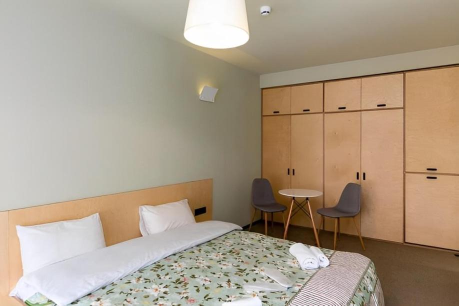 Ένα ή περισσότερα κρεβάτια σε δωμάτιο στο Studio in The Hills of Bakuriani Rooms Hotel Building