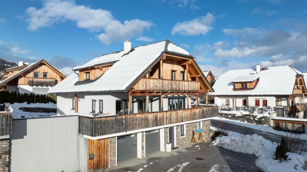 a house under construction in the snow at Panoramachalet Emmylou in Mauterndorf
