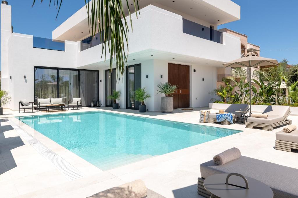 an image of a villa with a swimming pool at Lanik Luxury Pool Villa in Afantou