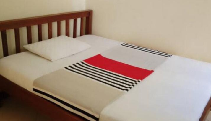 Ένα ή περισσότερα κρεβάτια σε δωμάτιο στο Legacy villas