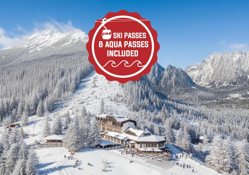 a ski lodge in the mountains with snow on the ground at Horská ubytovňa Hrebienok in Smokovce