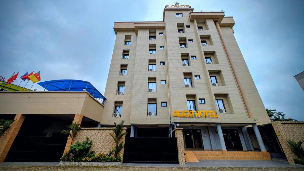 a talliege building with at ALICIA HOTEL in Douala