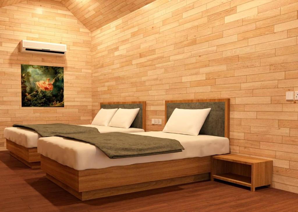 Postel nebo postele na pokoji v ubytování Royal C Resort