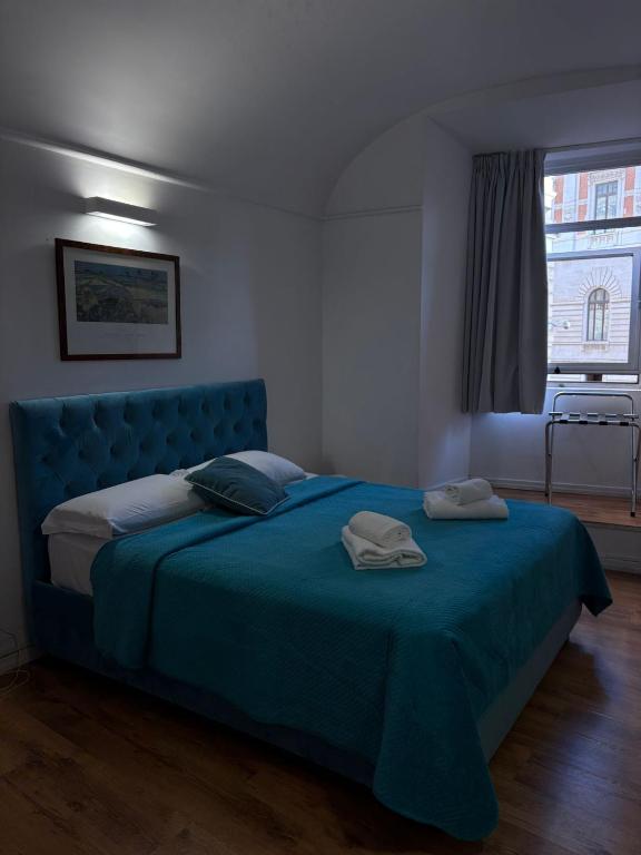 Ένα ή περισσότερα κρεβάτια σε δωμάτιο στο AH Suite Montecitorio