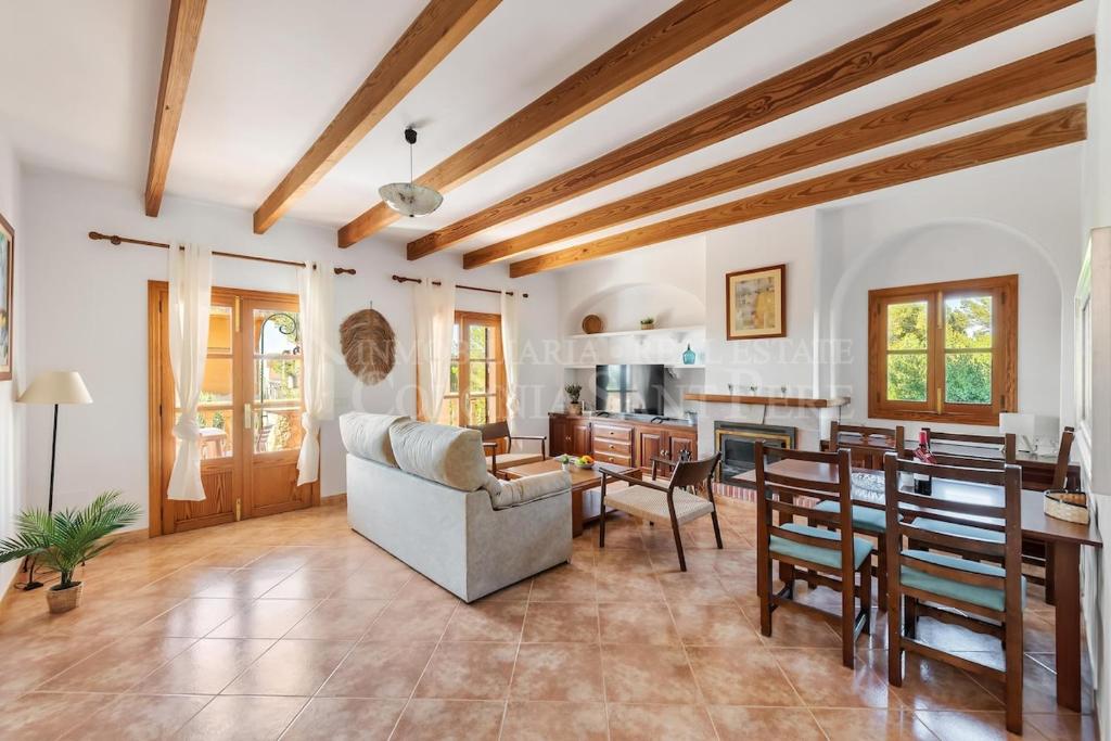 a living room with a couch and a table at Casa en Montferrutx in Colonia de Sant Pere
