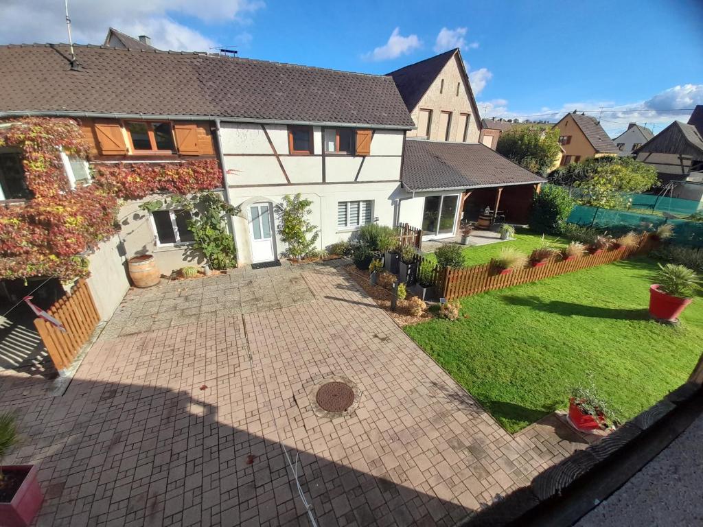 an aerial view of a house with a driveway at Au nid de cigo in Sigolsheim
