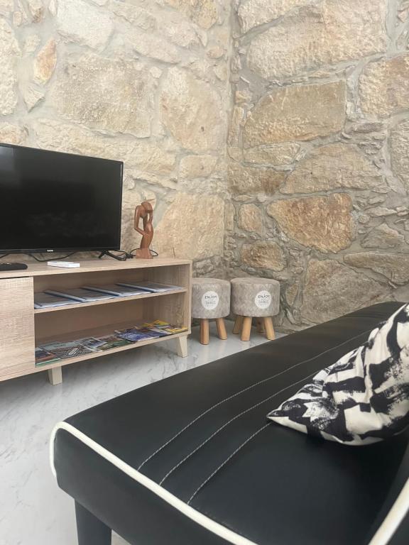 TV a/nebo společenská místnost v ubytování Candal house