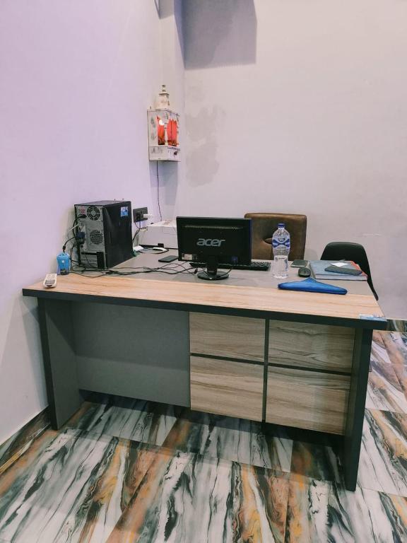 an office with a desk with two computers on it at Hotel Pleasure Inn in Prayagraj