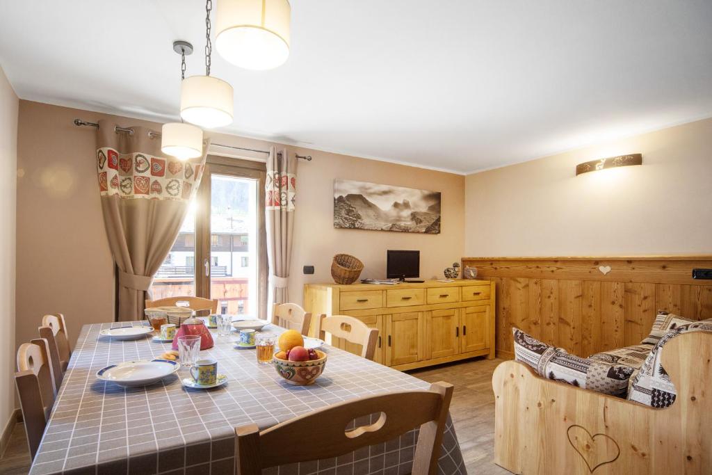 a kitchen and dining room with a table and chairs at Punta Ceresole 4061 Maison Gerard in Cogne