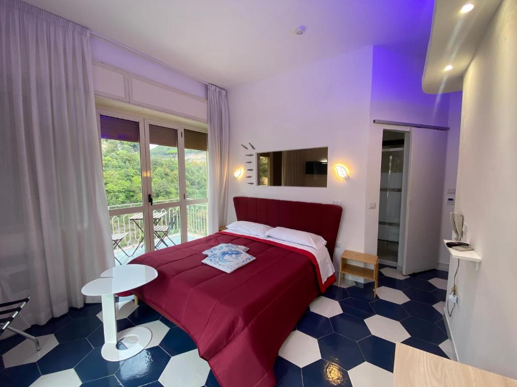 Postel nebo postele na pokoji v ubytování Hotel Vietri Coast