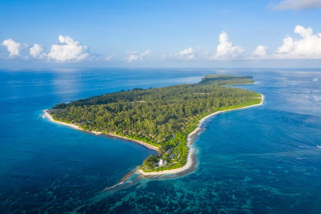 an aerial view of an island in the ocean at Four Seasons Resort Seychelles at Desroches Island in Desroches
