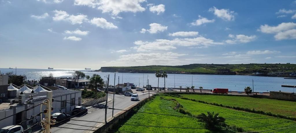 a view of a body of water next to a street at Ramla Boutique Home in Marsaskala