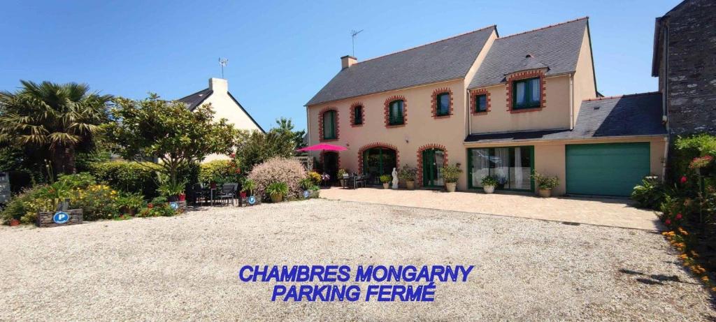 a house with a sign that reads chambers inventory parking fee at Chambres D'hôtes Mongarny Cancale in Cancale