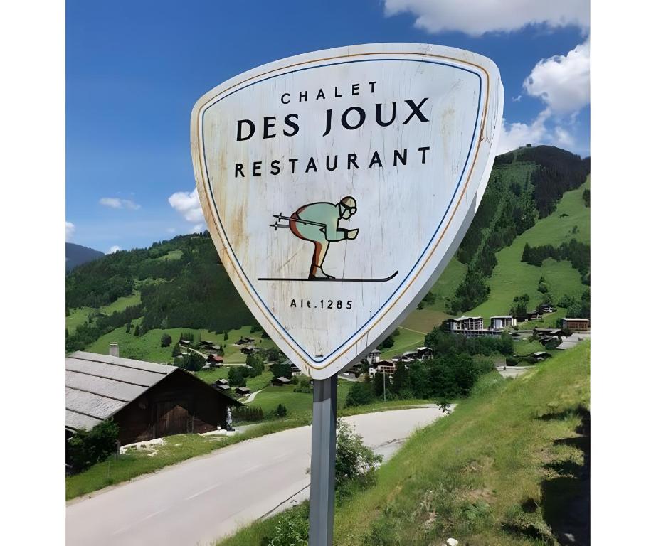 a sign on the side of a road at Chalet des joux in La Clusaz