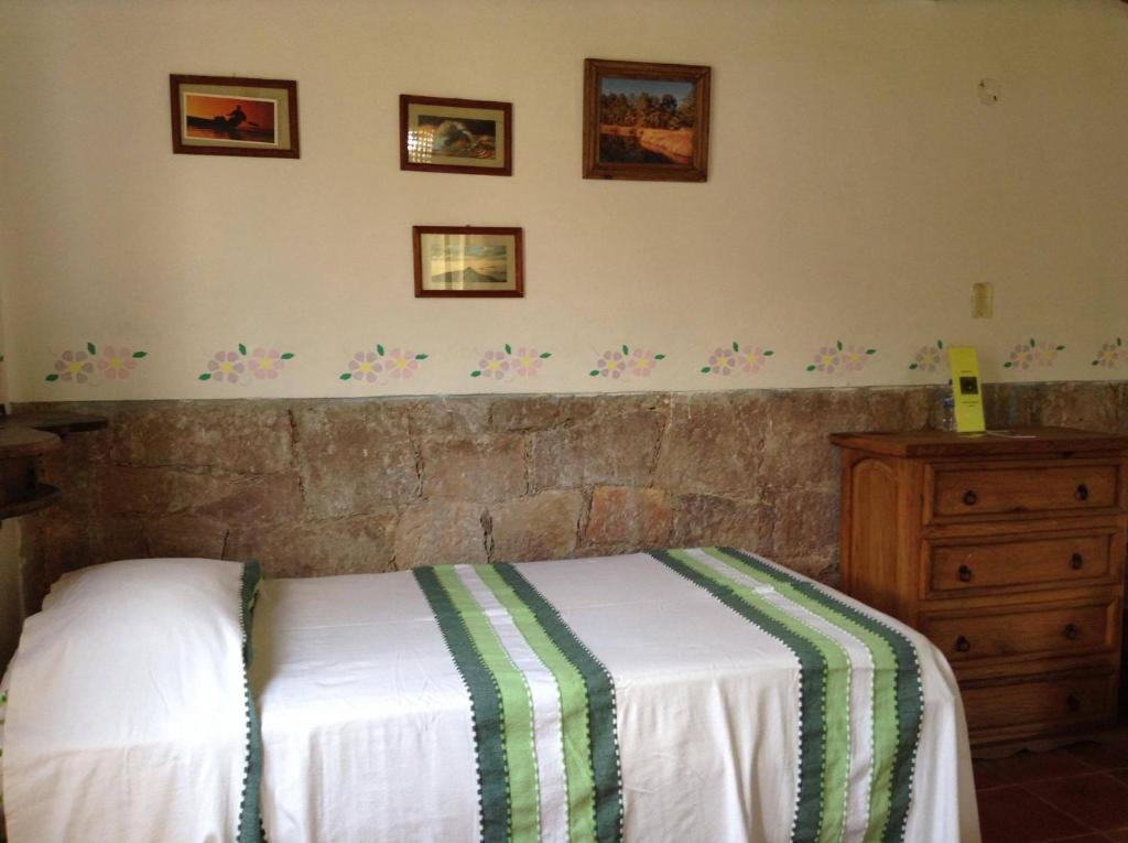 Postel nebo postele na pokoji v ubytování Manzano B&B