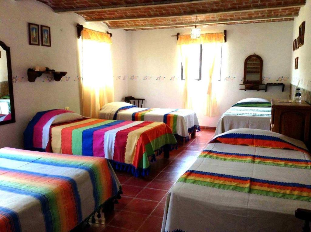 Postel nebo postele na pokoji v ubytování Manzano B&B