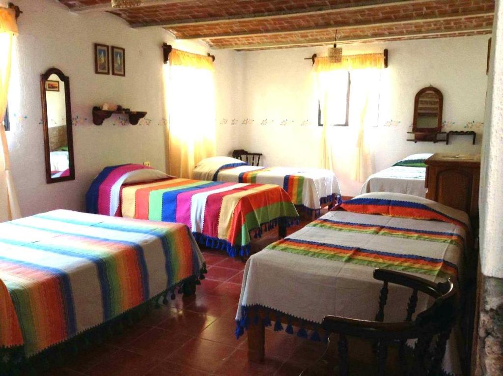 Postel nebo postele na pokoji v ubytování Manzano B&B