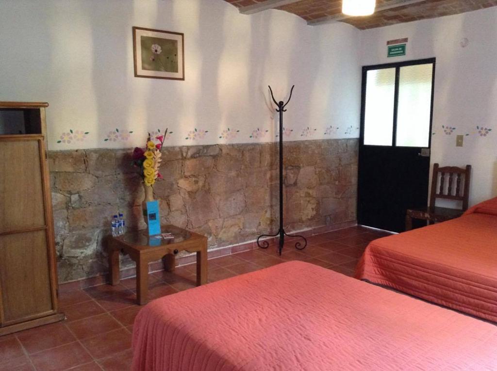Postel nebo postele na pokoji v ubytování Manzano B&B
