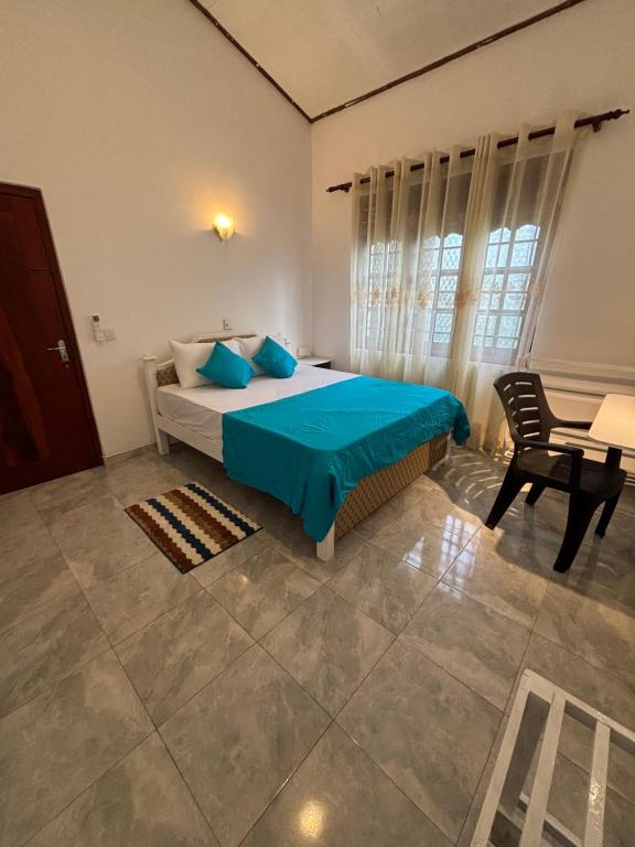 Ένα ή περισσότερα κρεβάτια σε δωμάτιο στο Thiya Mirissa