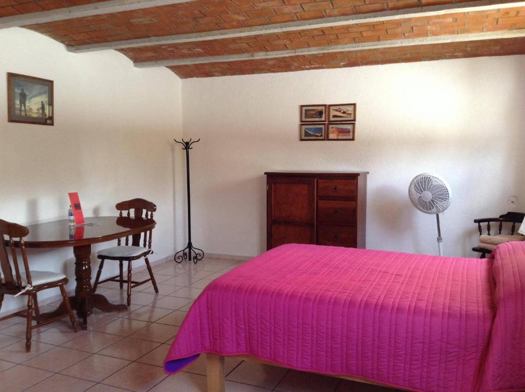 Postel nebo postele na pokoji v ubytování Manzano B&B
