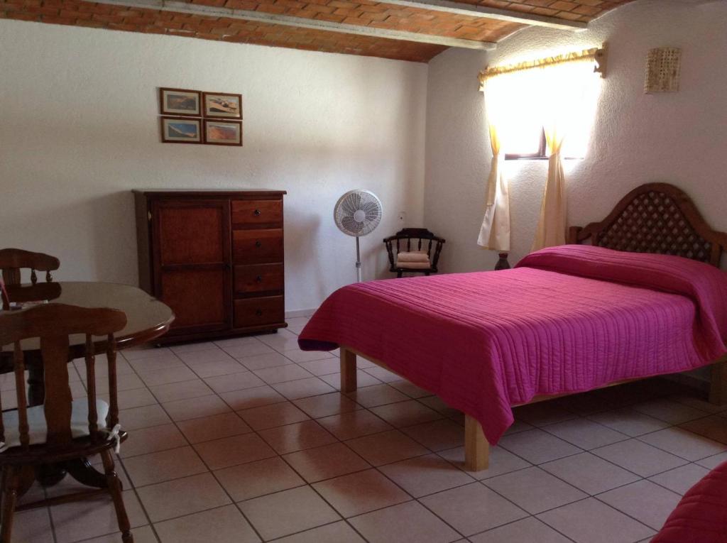 Postel nebo postele na pokoji v ubytování Manzano B&B