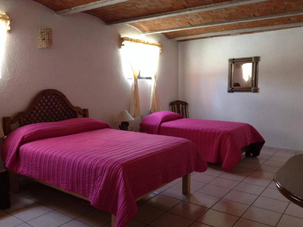 Postel nebo postele na pokoji v ubytování Manzano B&B