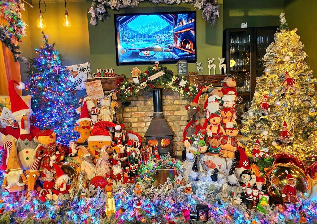 a room filled with christmas trees and christmas decorations at Beresford Cottage in Skegness