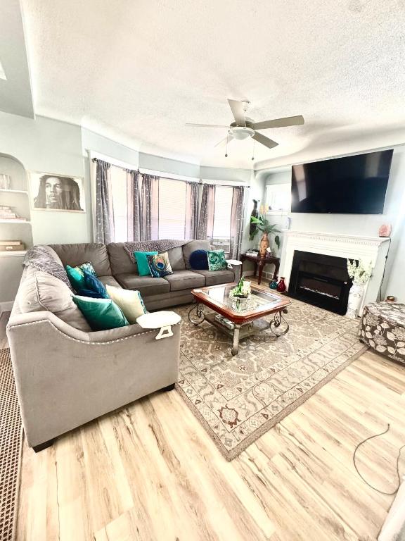 a living room with a couch and a fireplace at Cozy Home By University Circle VA,CC & Museum in Cleveland