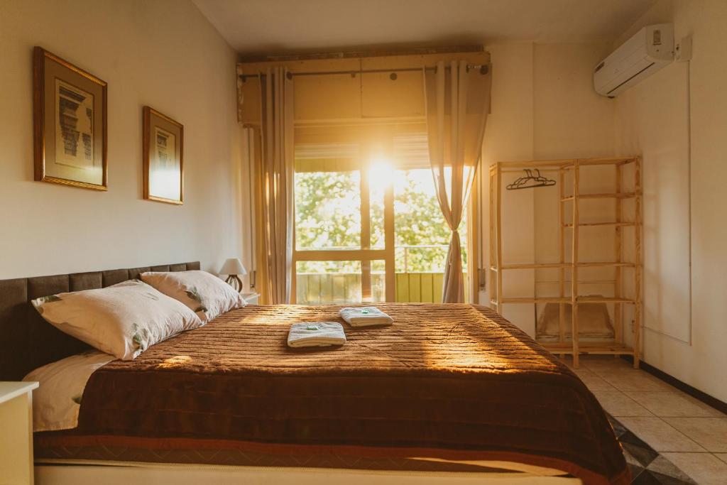 Ένα ή περισσότερα κρεβάτια σε δωμάτιο στο IKE Hospedagem Centro-Unidade2