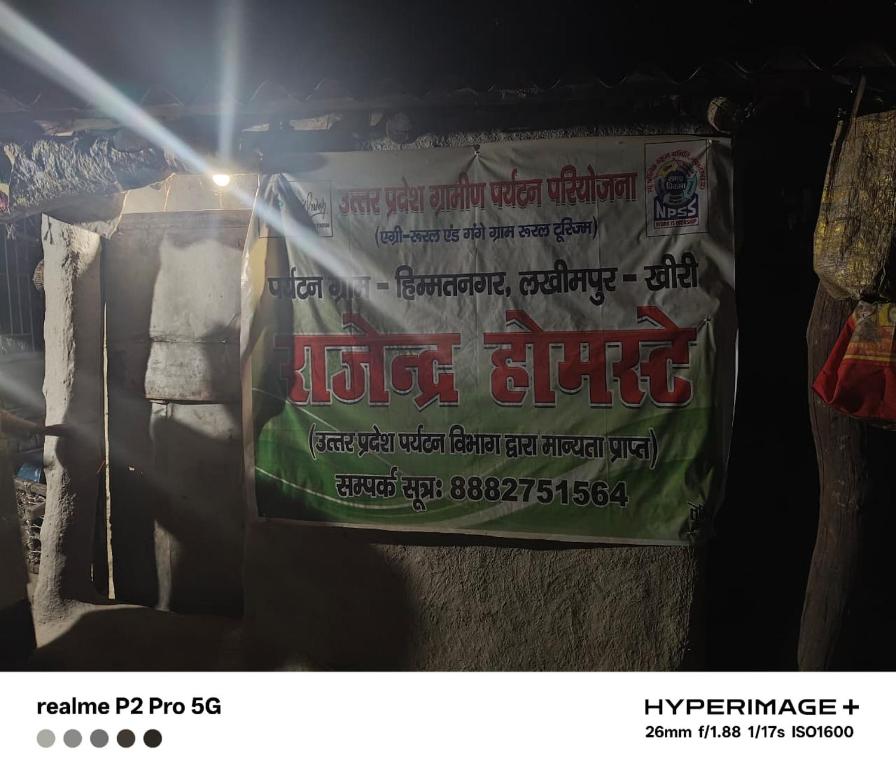 a sign on a wall with a bag of toilet stuff at Rajendra Homestey 