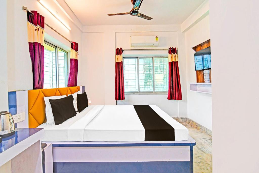 Ένα ή περισσότερα κρεβάτια σε δωμάτιο στο Hotel O Green Palace