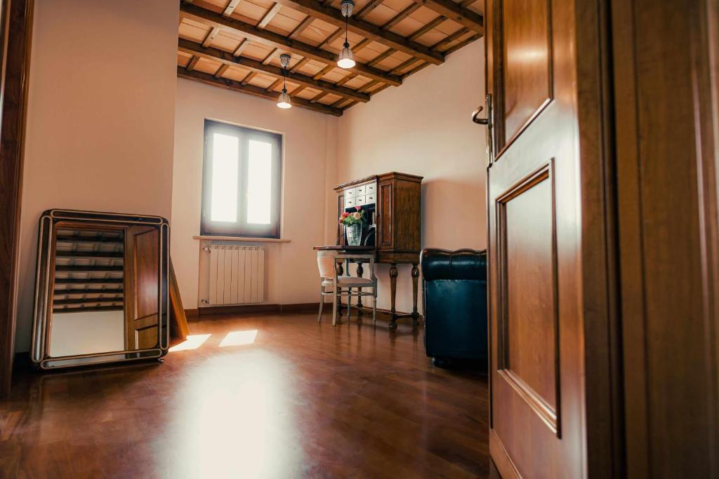 an empty room with a table and a window at Bed and Breakfast Villa Romano in Anzio