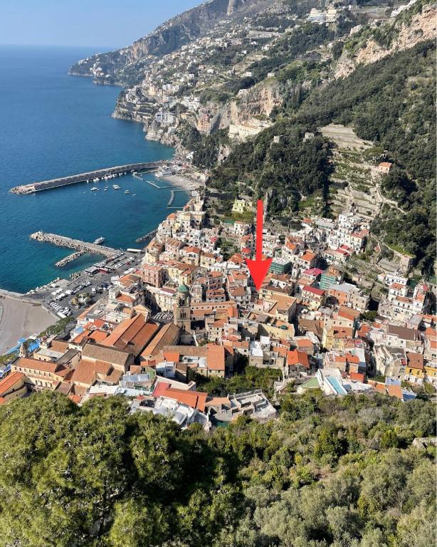 an aerial view of a town with a red arrow at Casa MAR e LUNA in Amalfi