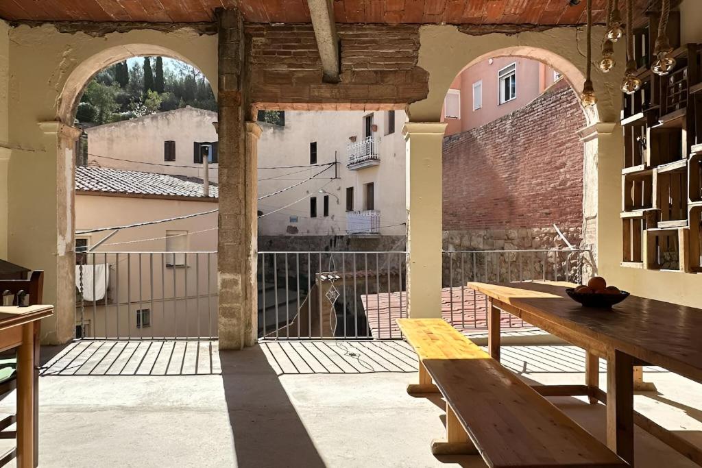 a large room with a table and a large window at Habitación Cavall Bernat en Casa Camí de les Aigües Monistrol de Montserrat in Monistrol