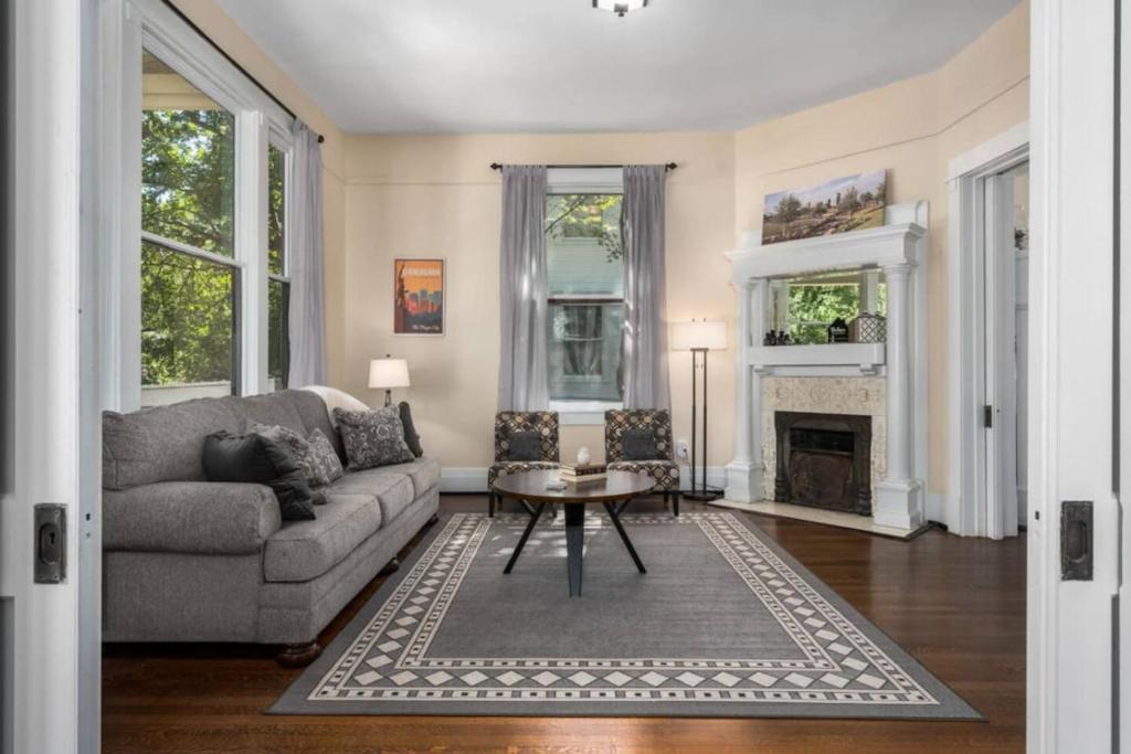 a living room with a couch and a table at Historic Birmingham 4 BR 3 Bath in Birmingham