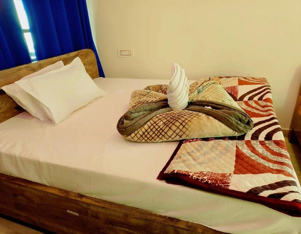 Postel nebo postele na pokoji v ubytování Resort Abhirup