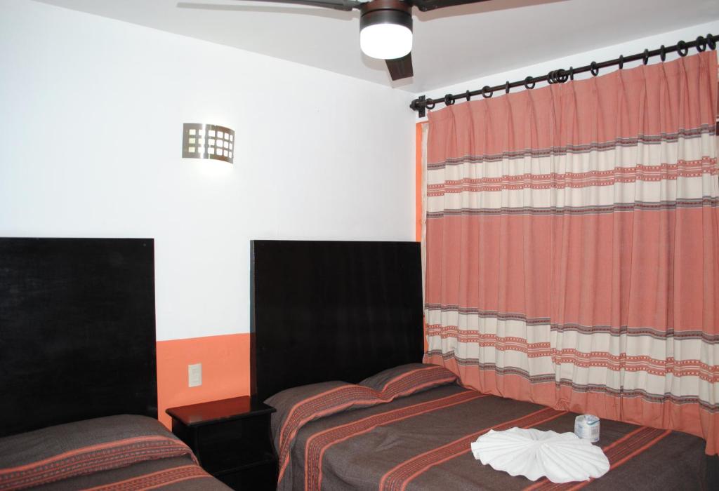 Postel nebo postele na pokoji v ubytování Hotel Jiménez