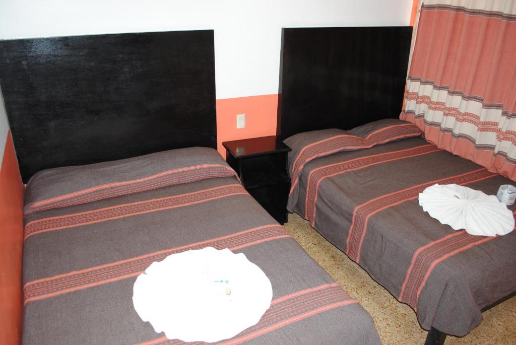 Postel nebo postele na pokoji v ubytování Hotel Jiménez