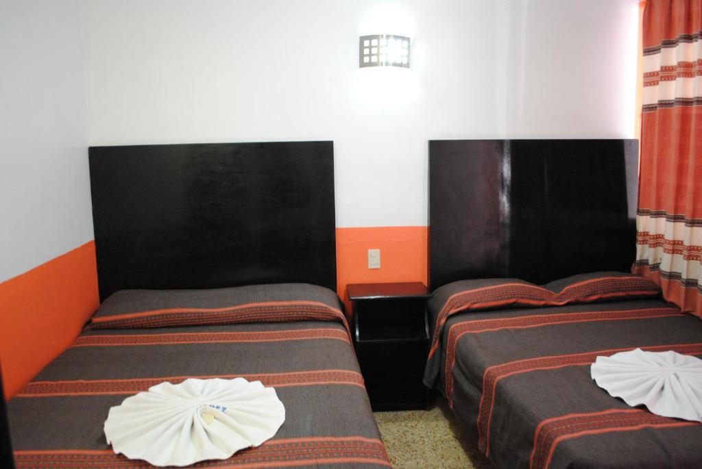 Postel nebo postele na pokoji v ubytování Hotel Jiménez
