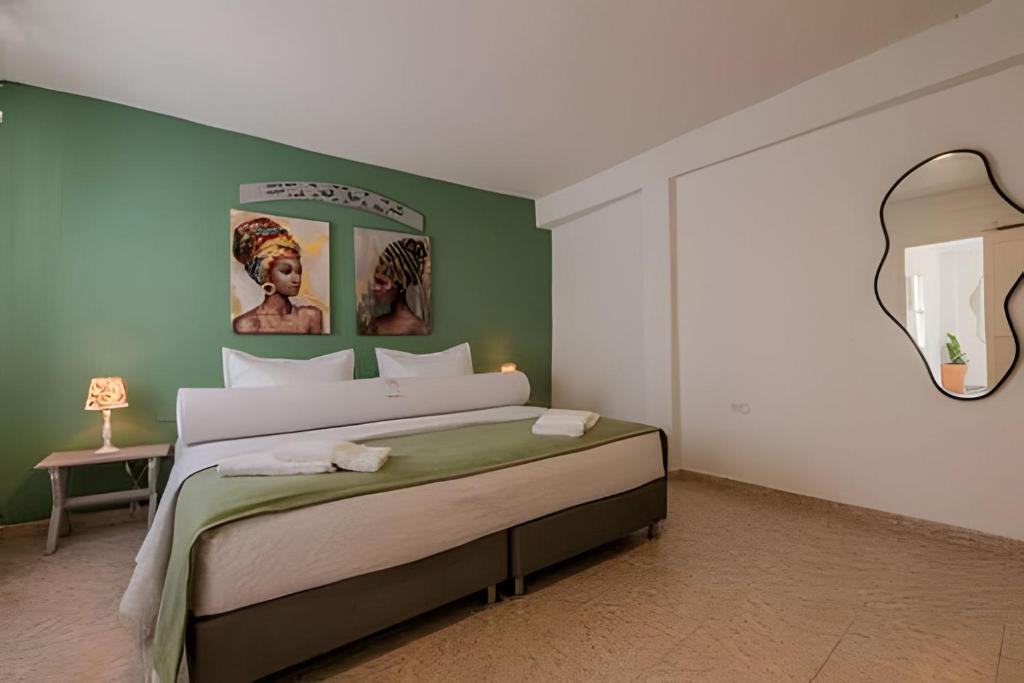 Giường trong phòng chung tại Casa Hibiscus