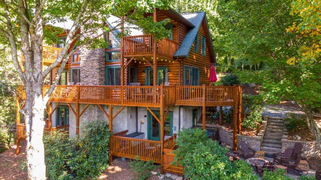 a large wooden house with a large deck at Windswept Vistas in Boone