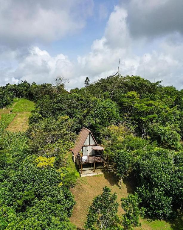 an aerial view of a small house on a hill at Exclusive Huts in Gravatá