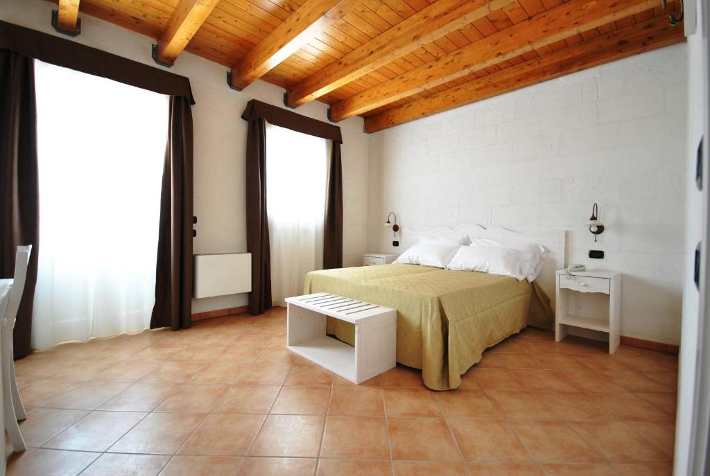 Postel nebo postele na pokoji v ubytování Tenuta Kyrios Agriresort Restaurant & Pool