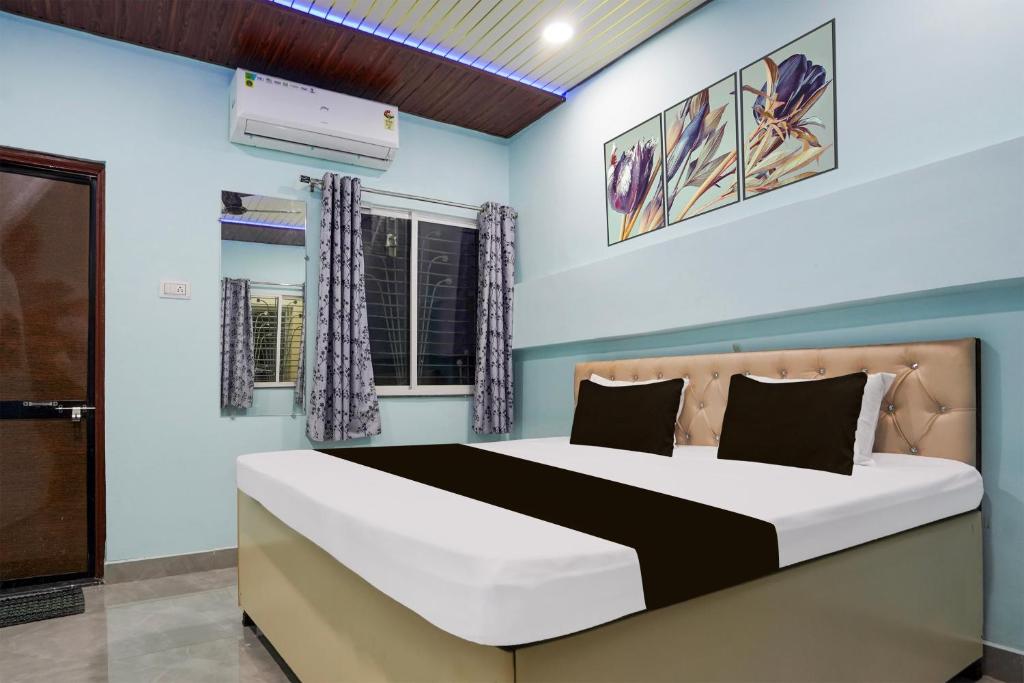 Ένα ή περισσότερα κρεβάτια σε δωμάτιο στο Hotel O JANNAT