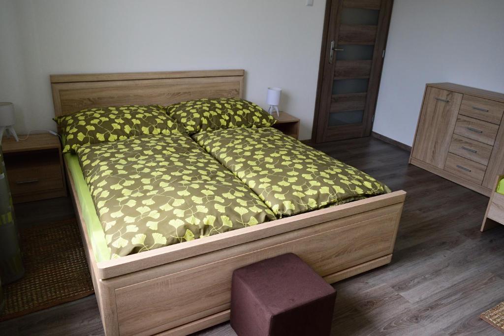 A bed or beds in a room at Apartmány Lenko - near thermal aquapark Tatralandia