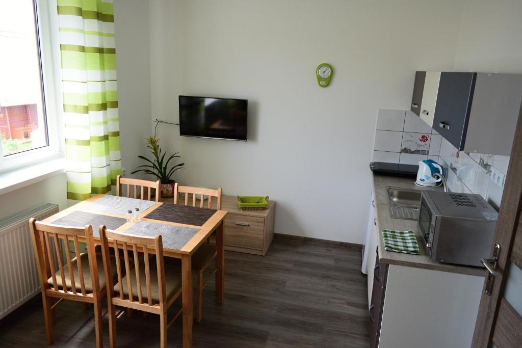 A kitchen or kitchenette at Apartmány Lenko - near thermal aquapark Tatralandia