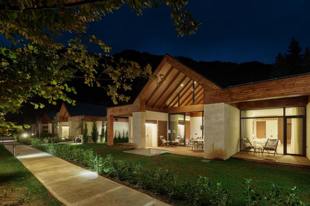 a home at night with the lights on at Terra Homes in Kolašin