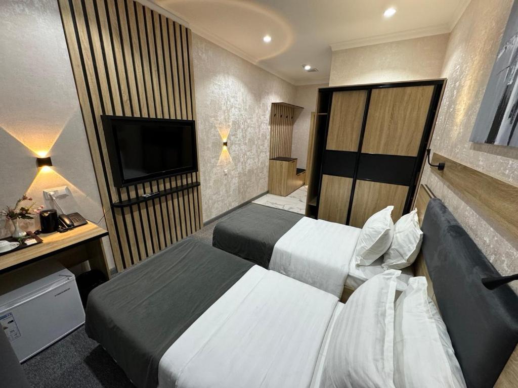 Postel nebo postele na pokoji v ubytování Art City Hotel