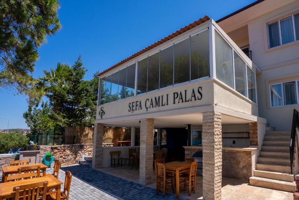 a building with a sign that reads sea camel plaza at Sefa Çamlı Palas in Ayvalık